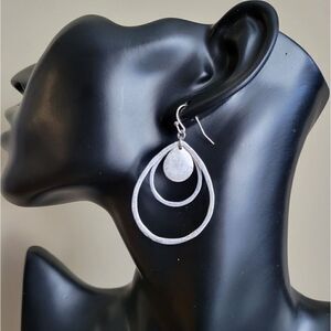 Silver tone costume jewelry pierced dangle earring. NWOT